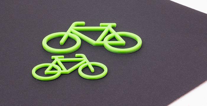 grünes Rad auf schwarzem Grund