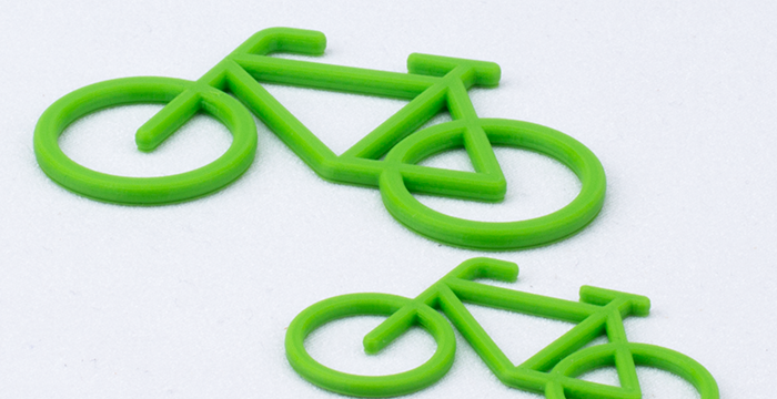 grünes Rad auf weißem Grund