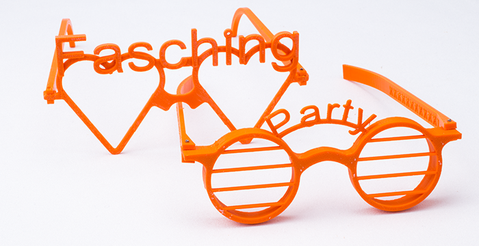 zwei orange Partybrillen, Fasching und Party