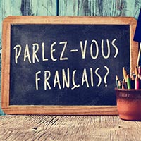 "Parlez vous Franzais" auf ener Tafel geschrieben. 