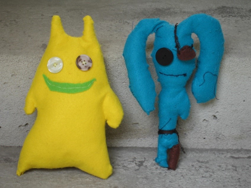 Textiles Kuschelmonster in gelb und grün