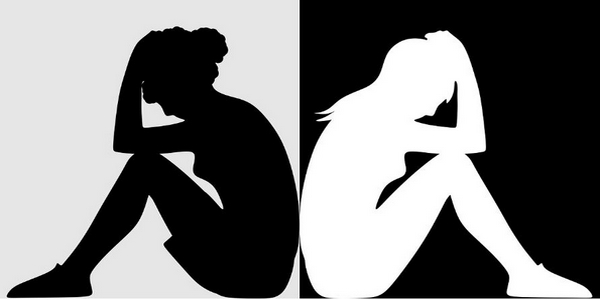 Black & White: zwei stilisierte weibliche Figuren sitzen Rücken an Rücken